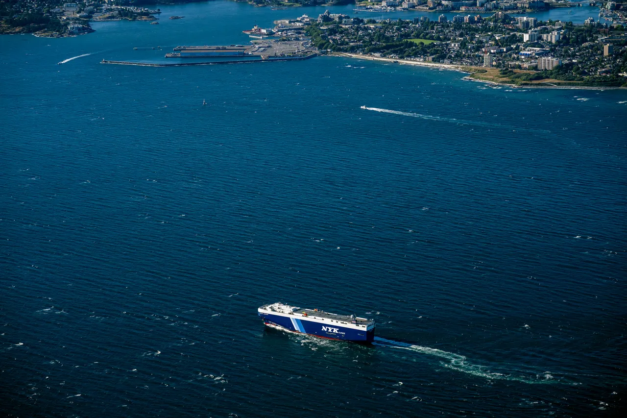 Strait of Juan de Fuca Aerial with Boat and City in Background