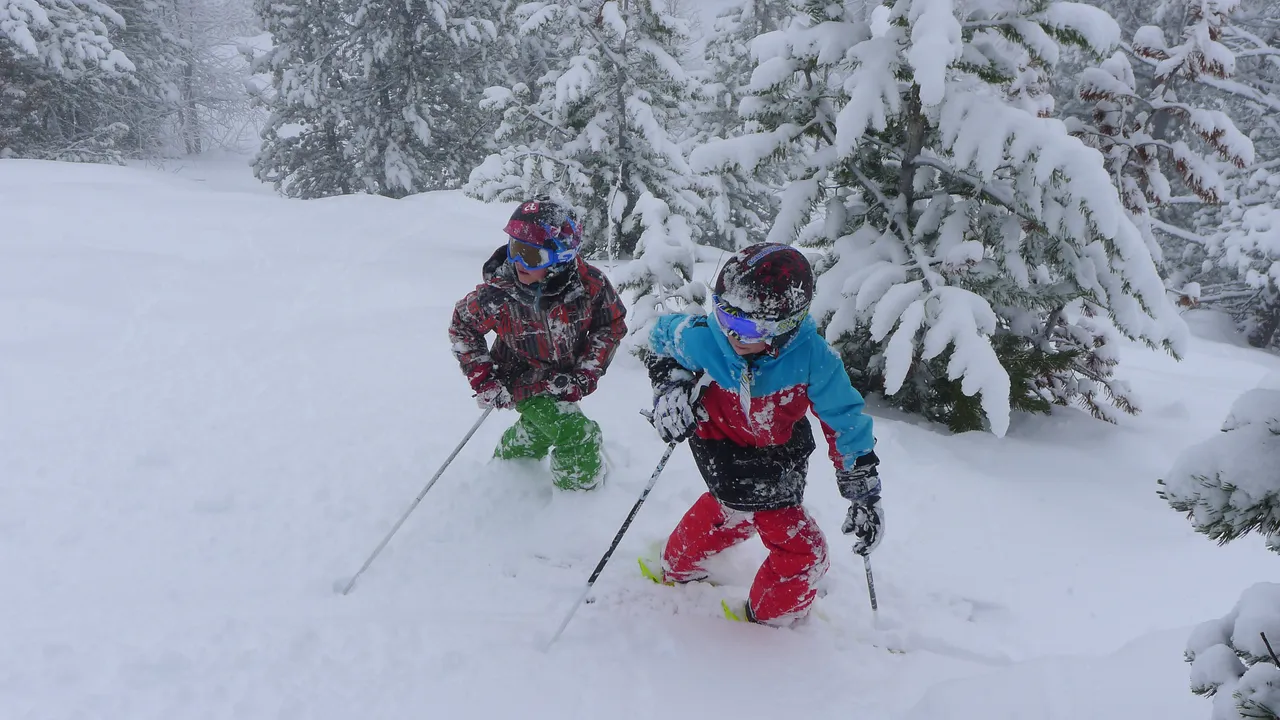 Kids enjoying the powder on the frontside of the mountain.